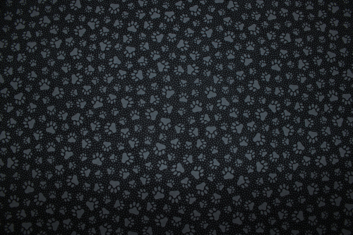 Preview: Designerbaumwollstoff Black Paw Prints (10 cm)